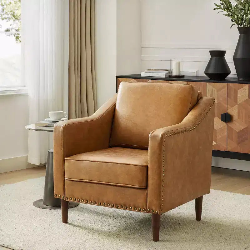 Fauteuil en cuir végétalien de transition avec coussin d'assise amovible et clous décoratifs