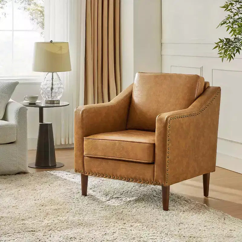 Fauteuil en cuir végétalien de transition avec coussin d'assise amovible et clous décoratifs