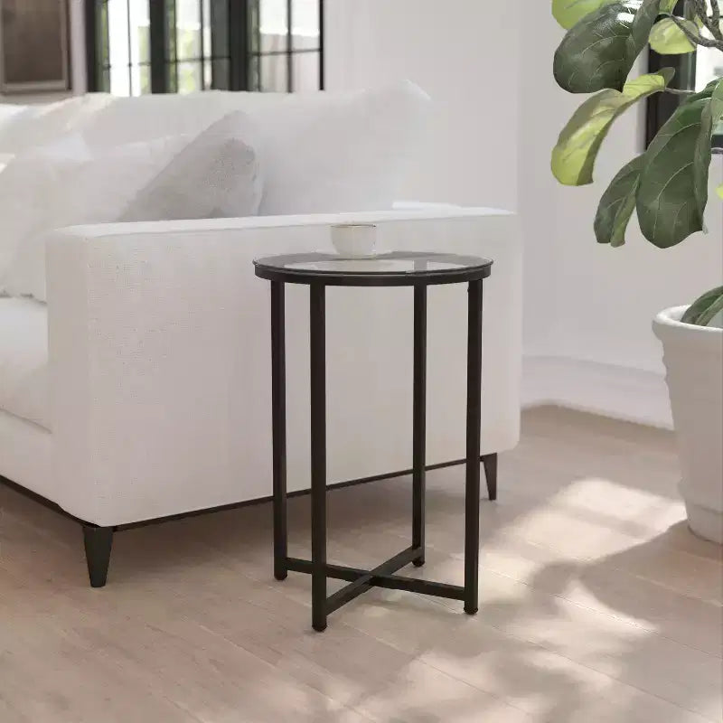 Table basse de salon en verre avec piètement en métal entrecroisé
